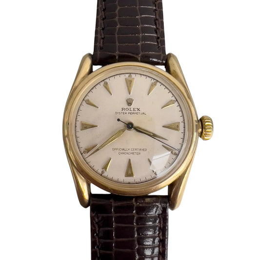 1950s Rolex Oyster Perpetual 6090 14k Yellow Gold White Dial Bombay Lugs 33mm
