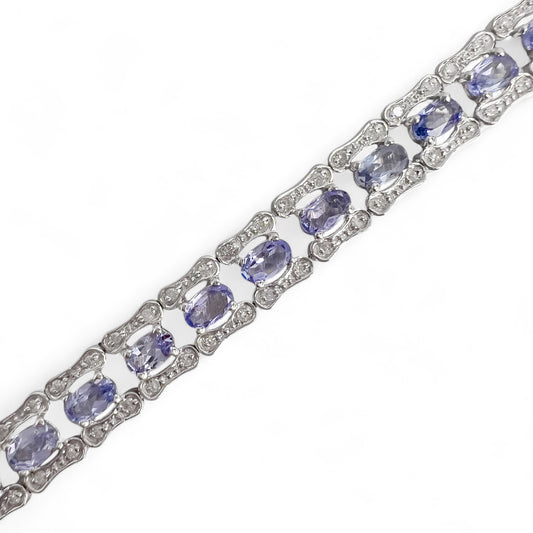 14k White Gold 6.00ctw Oval Tanzanite & 0.50ctw H I1 Diamond Tennis Bracelet 7"